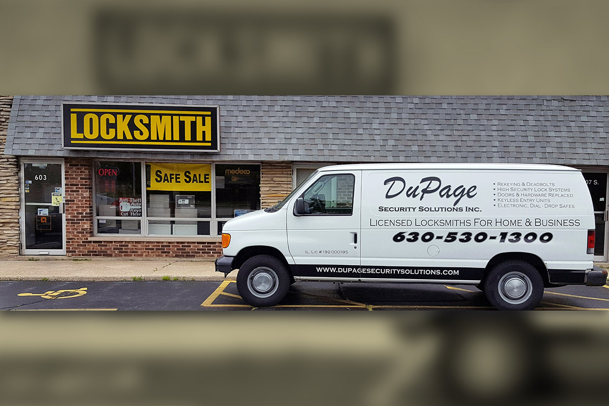 Photo of the DuPage Security Solutions storefront with their truck parked outside
