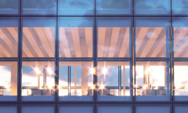 front view of modern skyscraper. modern office interior in evening time.panoramic windows facade background, contemporary business center.empty meeting room.real horizontal mockup,flares. 3d rendering